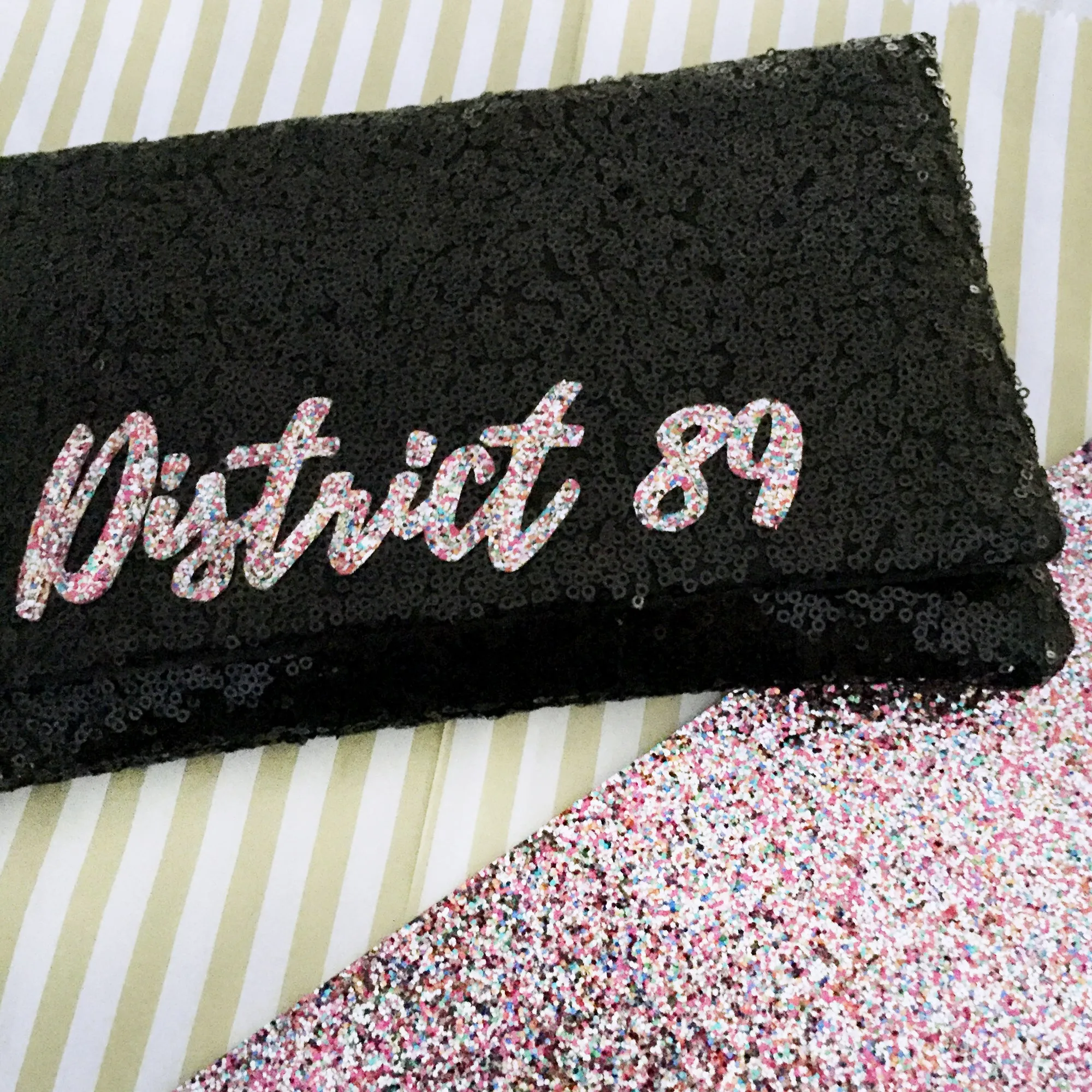 Black or navy SLOGAN sequin clutch handbag
