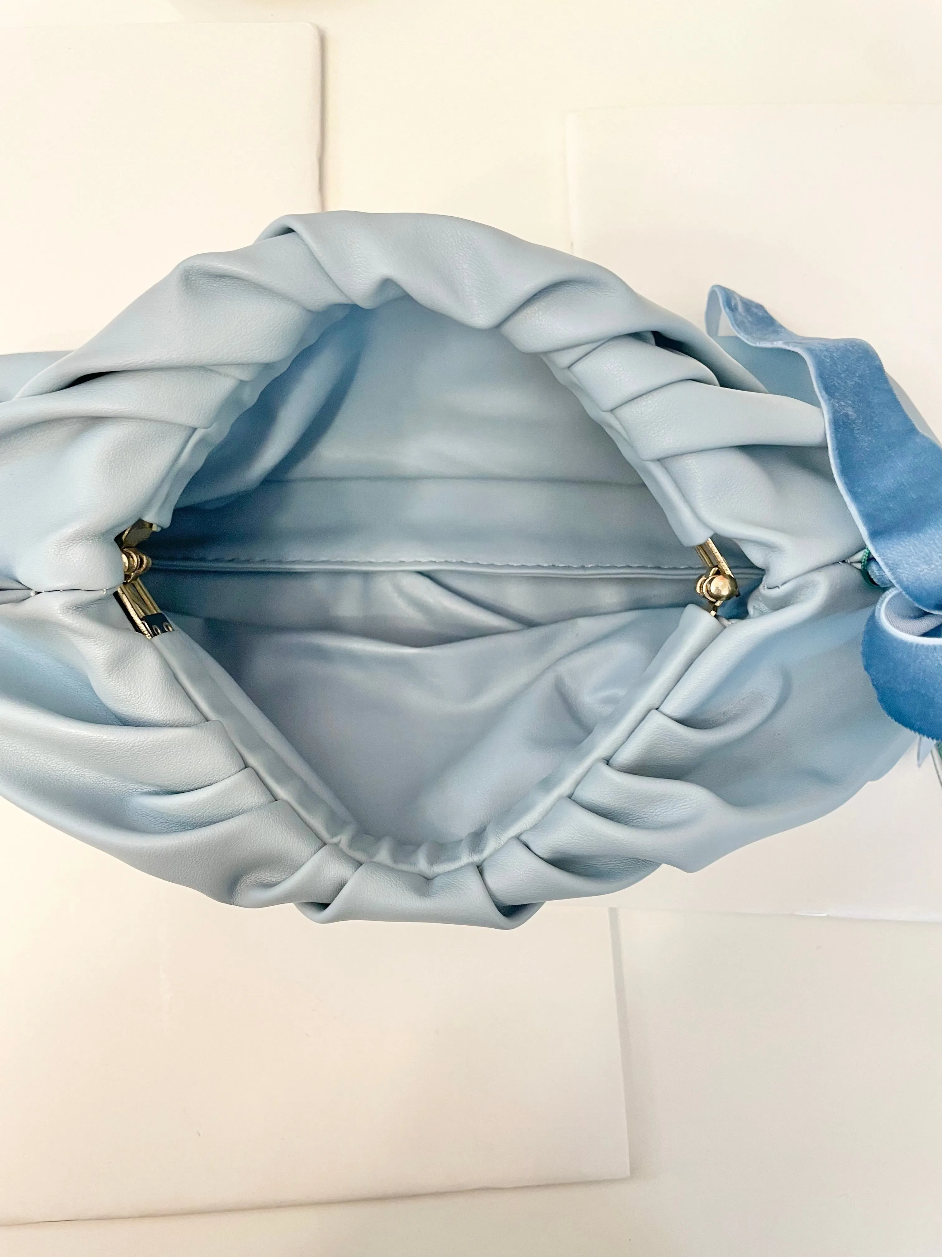The most feminine soft blue tassel clutch bag... so lovely